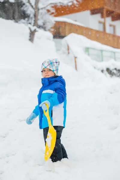 The boy goes for a drive on an snow slope. — Stock Photo, Image