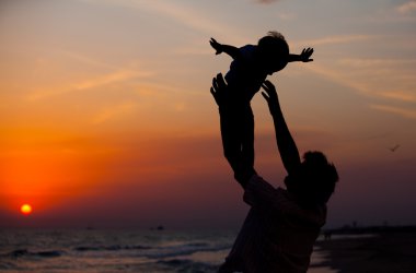 Father and little son silhouettes clipart