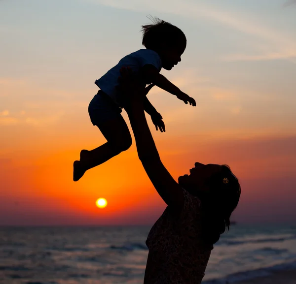 Mother and little son silhouettes — Stock Photo, Image