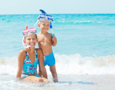 Happy Divers On A Beach clipart