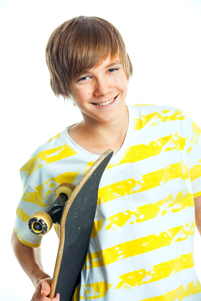 Portrait blond boy with skateboard