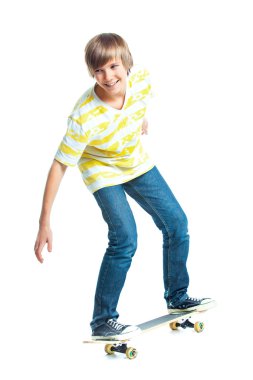 Blond boy on standing on skateboard clipart