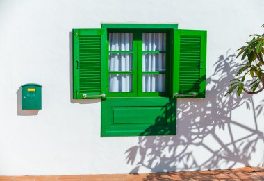 Colonial window on a wall clipart