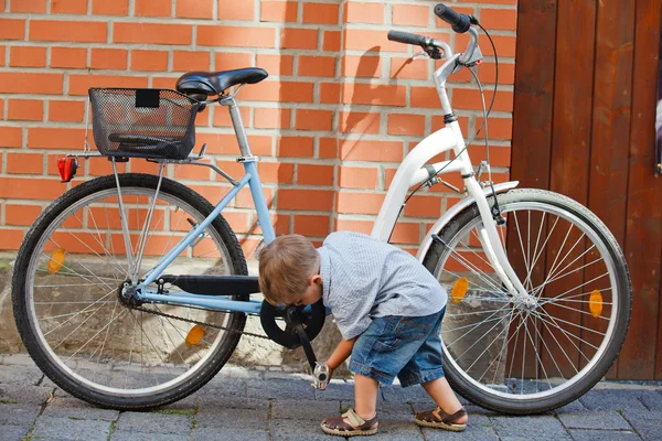 Cute little boy with big bike — Stock Photo, Image