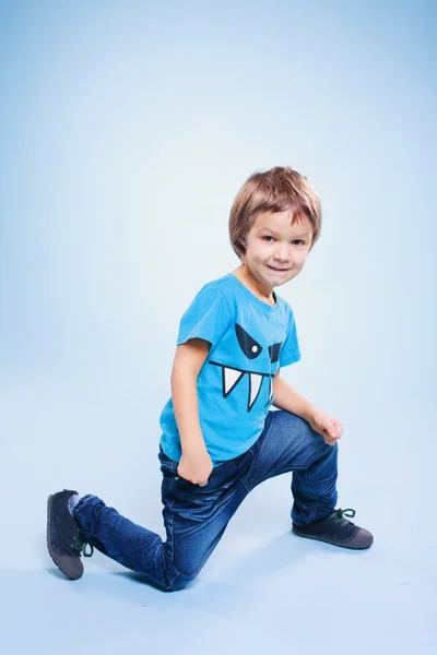 Smiling cute boy in the studio — Stock Photo, Image