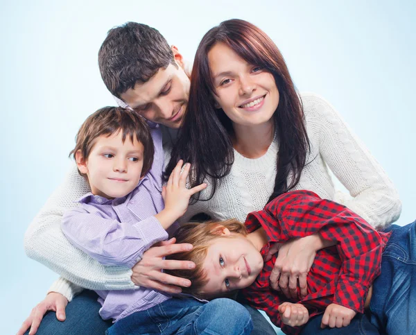 Cute family of a four — Stock Photo, Image