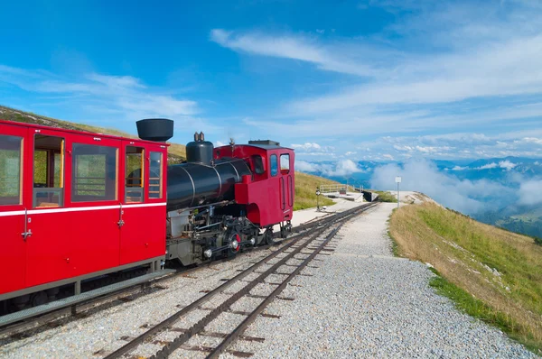 stock image Cog railway train climbing up to the mountain