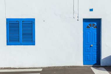 Colonial window and door on a wall clipart