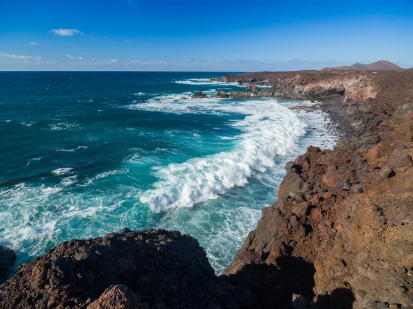 View through rocks on coastline — Stock Photo, Image