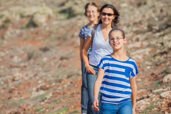 Family hiking in the cross-country — Stock Photo, Image