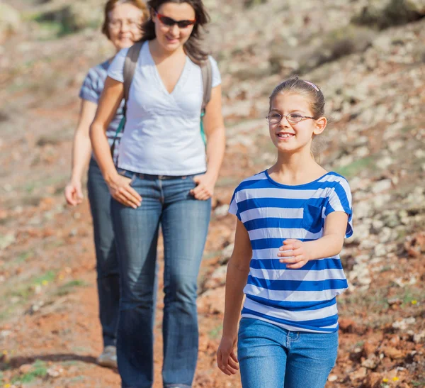 Family hiking in the cross-country — Stock Photo, Image