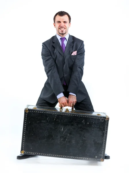 Uomo d'affari con grande vecchia valigia — Foto Stock