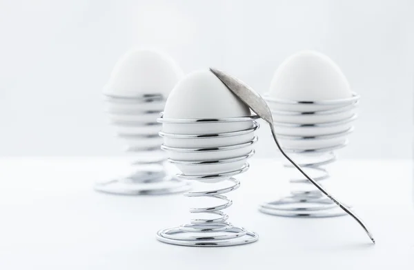 Eggs in metal stands — Stock Photo, Image