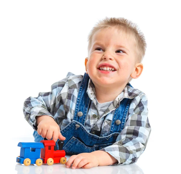 Cute little boy playing trains — Stock Photo, Image