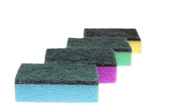 Four colored sponges for washing dishes and cleaning — Stock Photo, Image