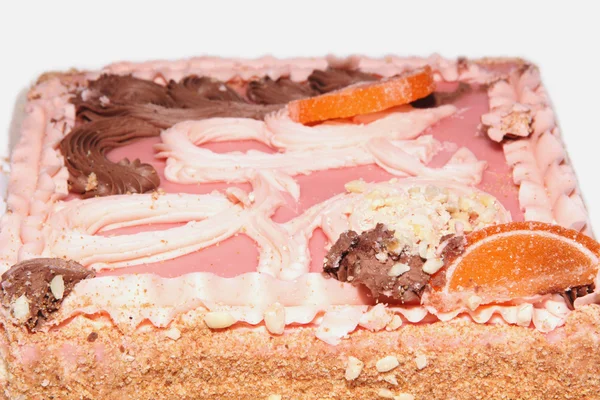 Bolo de areia com cobertura rosa, frutas cristalizadas e creme — Fotografia de Stock