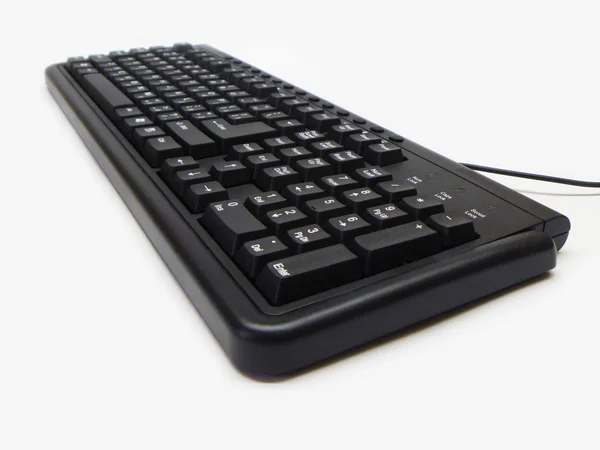 Blackenning elektronisk tastatur på hvid baggrund - Stock-foto