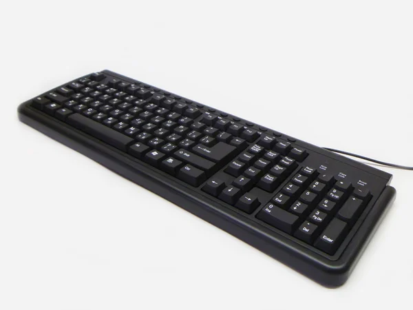 在白色背景上的 blackenning 电子键盘 — 图库照片