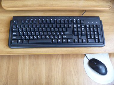 Blackenning keyboard on table clipart