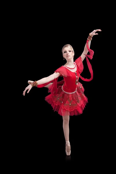 Ballerina wearing red tutu posing on isolated black — Stock Photo, Image