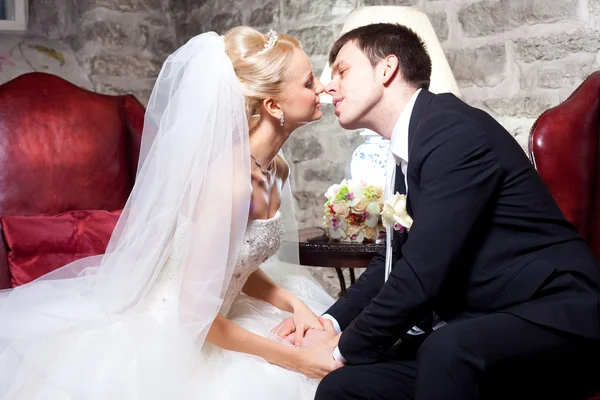 Beautiful groom and bride in interior — Stock Photo, Image