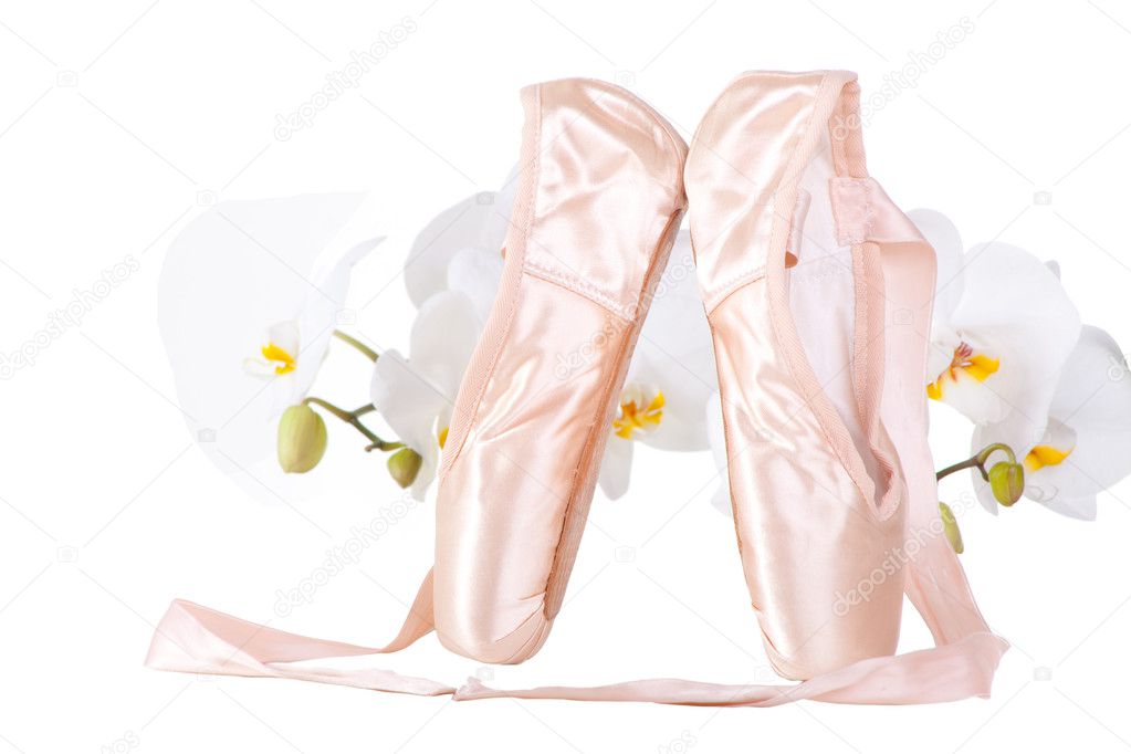 Ballet pointes with orchids on isolated white