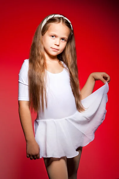 Little ballet dancer on a red background — Stock Photo, Image
