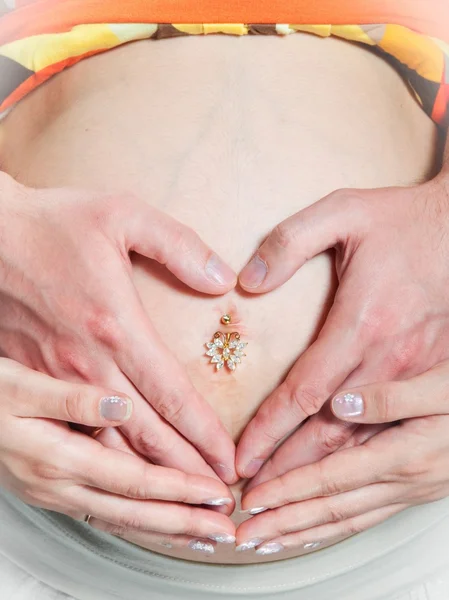 Pregnant woman tummy with husband hands — Stock Photo, Image