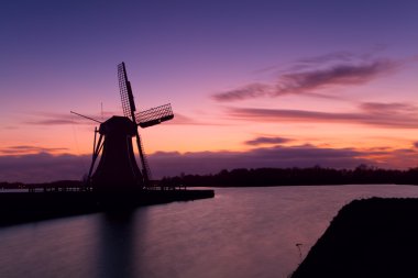 Windmill silhouette in Groningen clipart