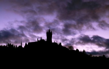 Silhouette of castle on the hill clipart