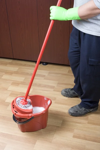 Cleaner mopping floor in office — Stock Photo, Image