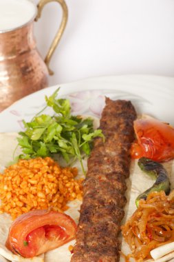 Turkish traditional kebab specials ready to serve with ayran clipart