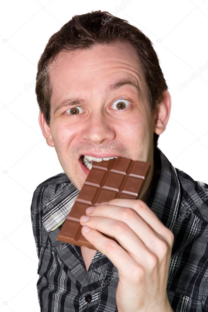 Man eating a mighty hard chocolate