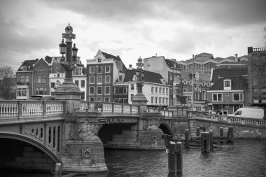 Amsterdam canal and traditional buildings clipart