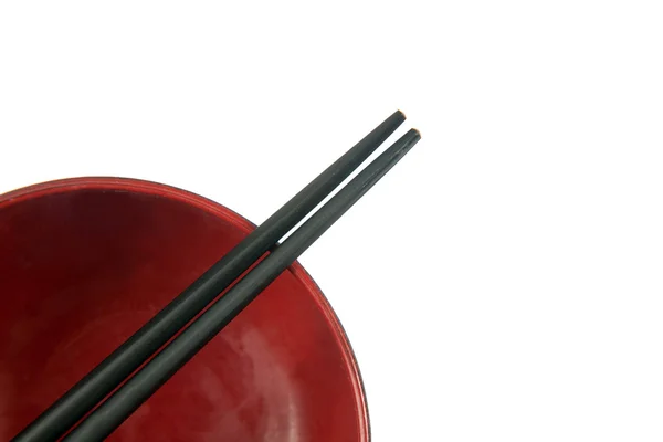 Red wooden bowl and chopstick — Zdjęcie stockowe