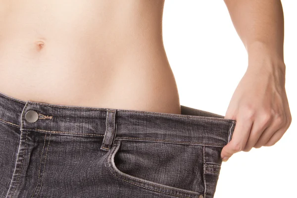 Mujer testaruda muy delgada en jeans —  Fotos de Stock