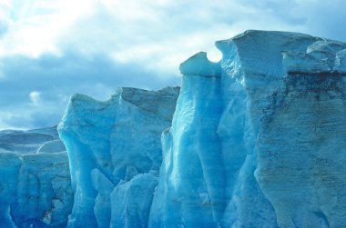 Blue ice against the sky clipart