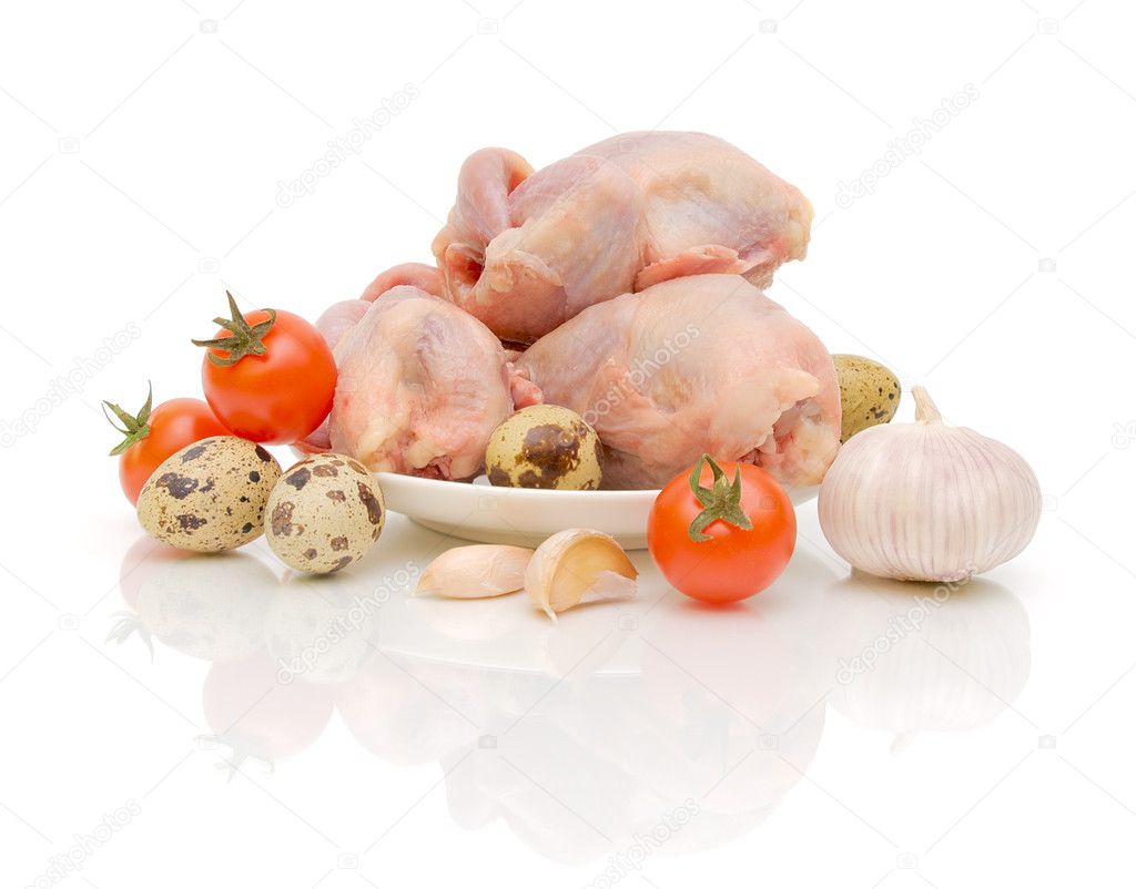 Quail carcasses, eggs and vegetables on white background