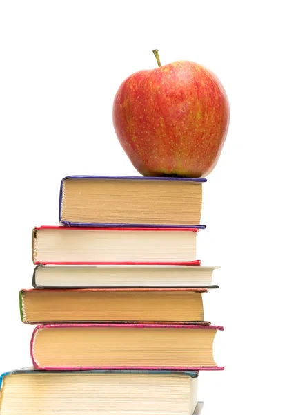 Red apple on pile of books — Stock Photo, Image