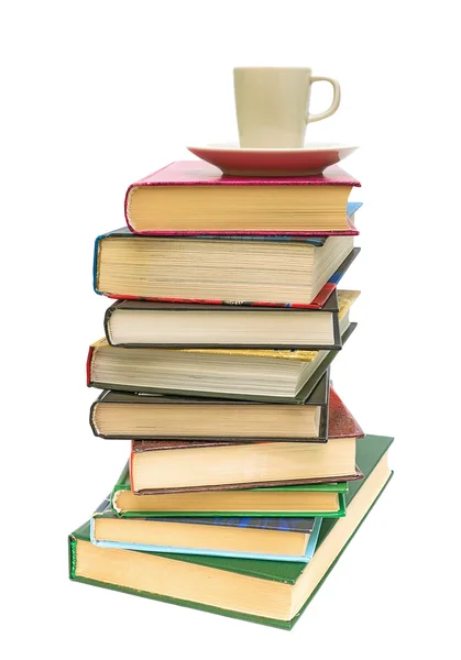 Stack of books and coffee cup on white background — Stock Photo, Image