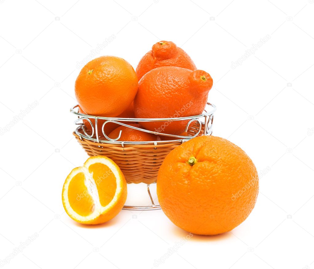 Oranges and tangerines captured a vase on a white background