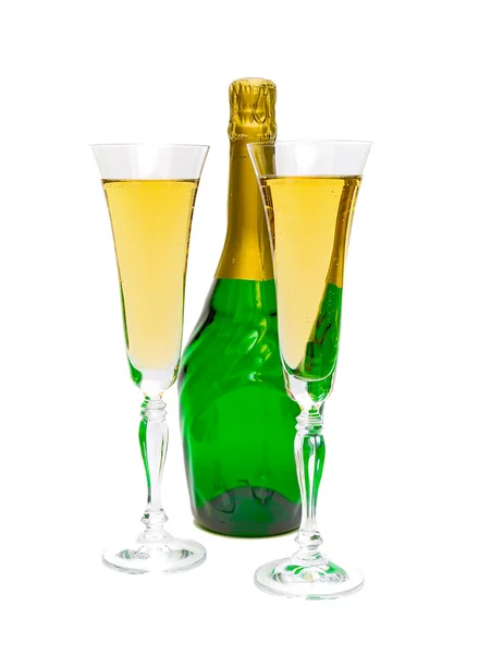 Glasses and a bottle of champagne on a white background — Stock Photo, Image