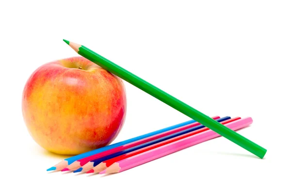 Apple and pencils on a white background — Stock Photo, Image