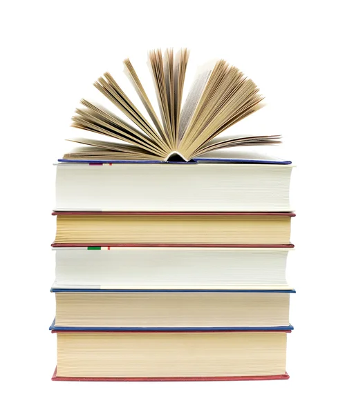 Open book on a pile of books on a white background — Stock Photo, Image