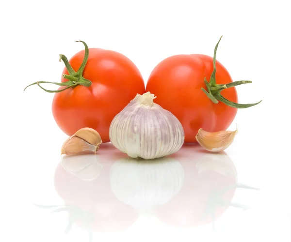 Knoflook en tomaten close-up — Stockfoto