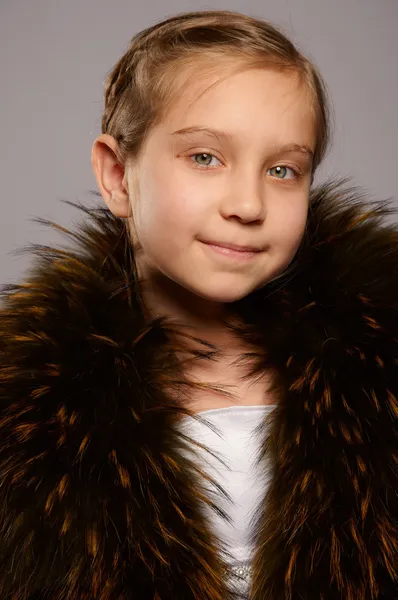 Smiling girl blonde in fur coat — Stock Photo, Image
