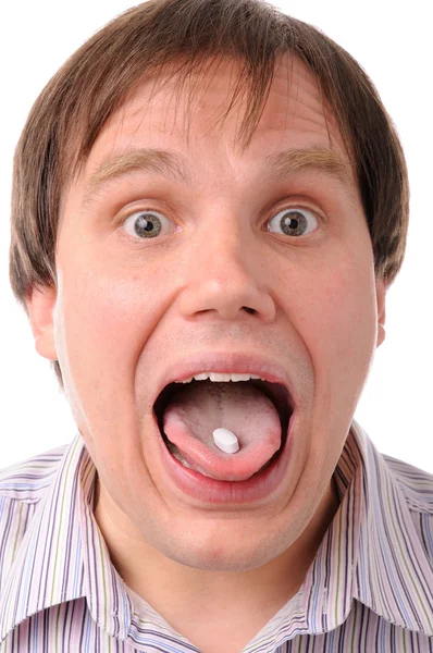 舌の上でタブレットを持つ男 — ストック写真