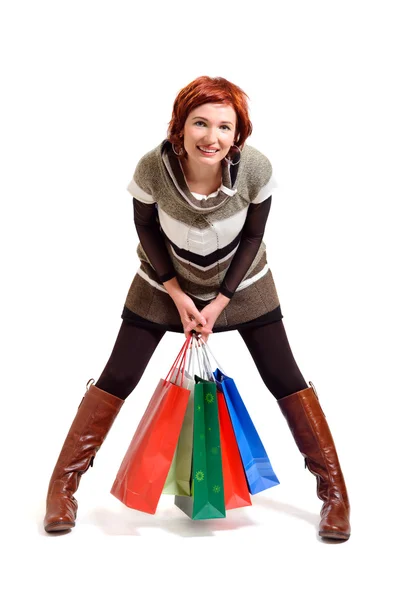 Mulher atraente segurando sacos de compras — Fotografia de Stock
