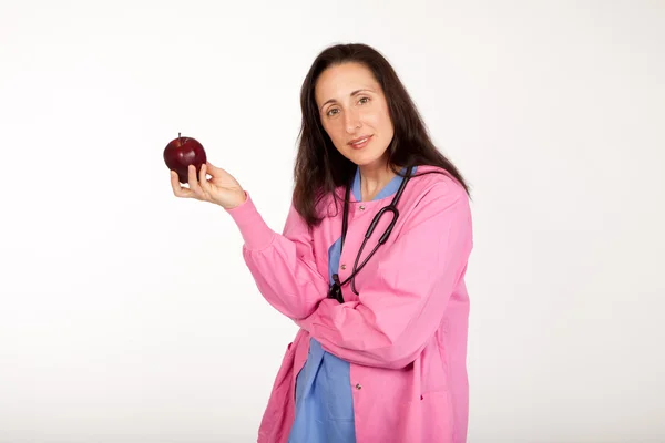 Doctor Offers Apple — Stock Photo, Image