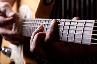 Close up shot of a man playing guitar clipart